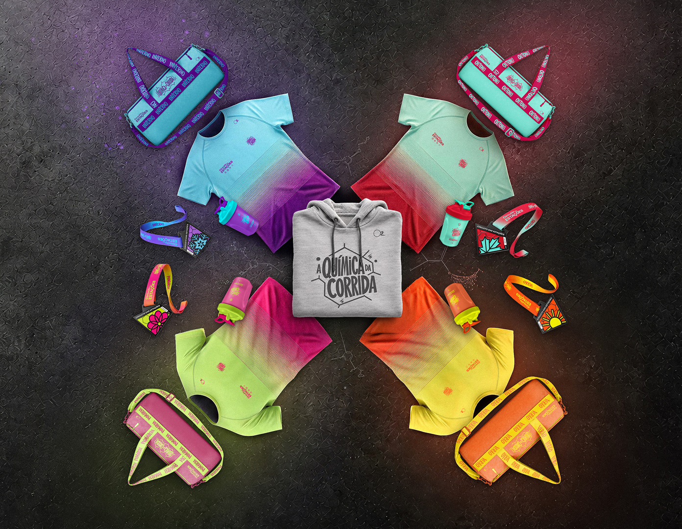 Kit completo do combo: as camisetas, bolsas, garrafas e medalhas das quatro etapas, com o hoodie A Química da Corrida no centro